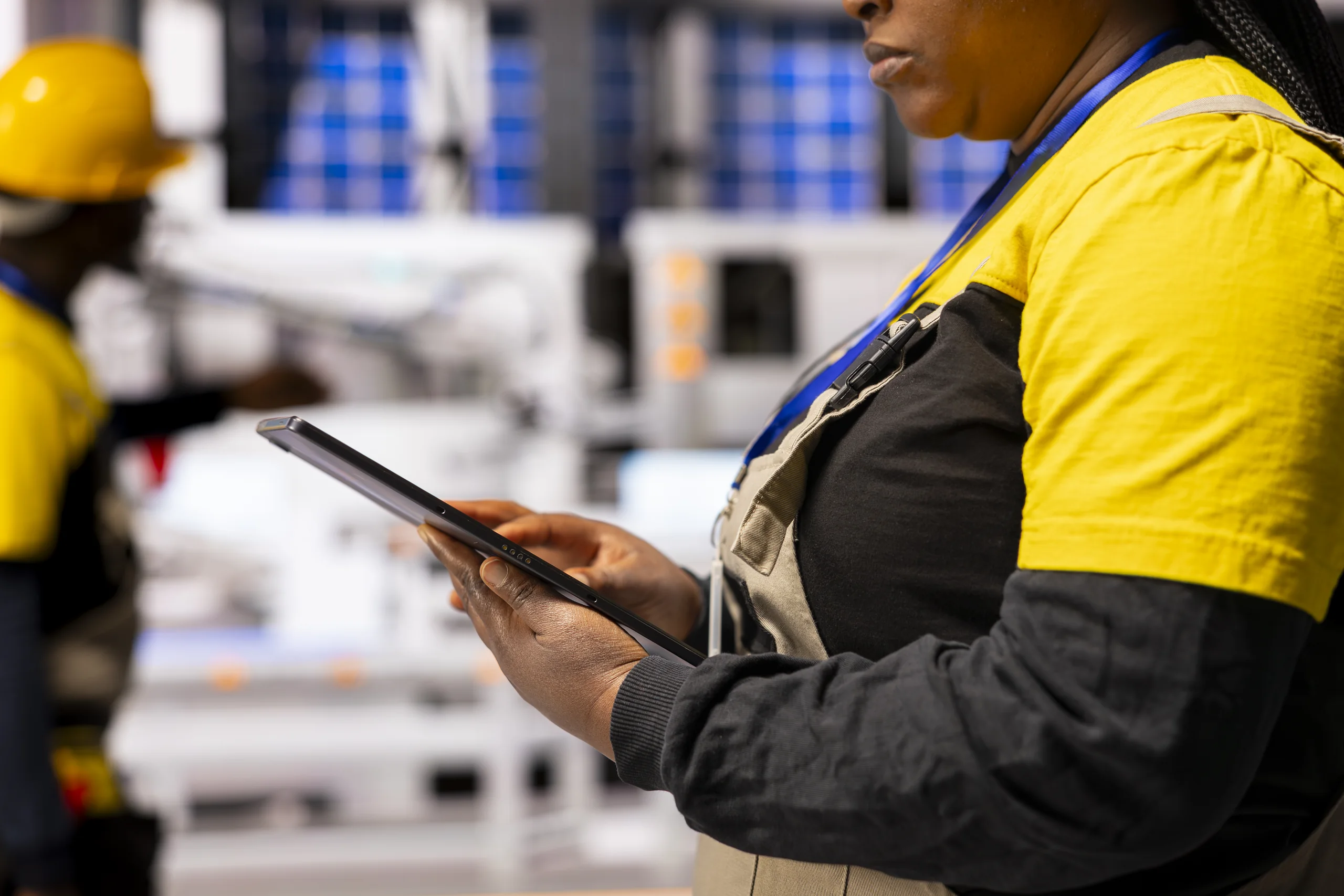 Engineering professional evaluating an industrial automation line
