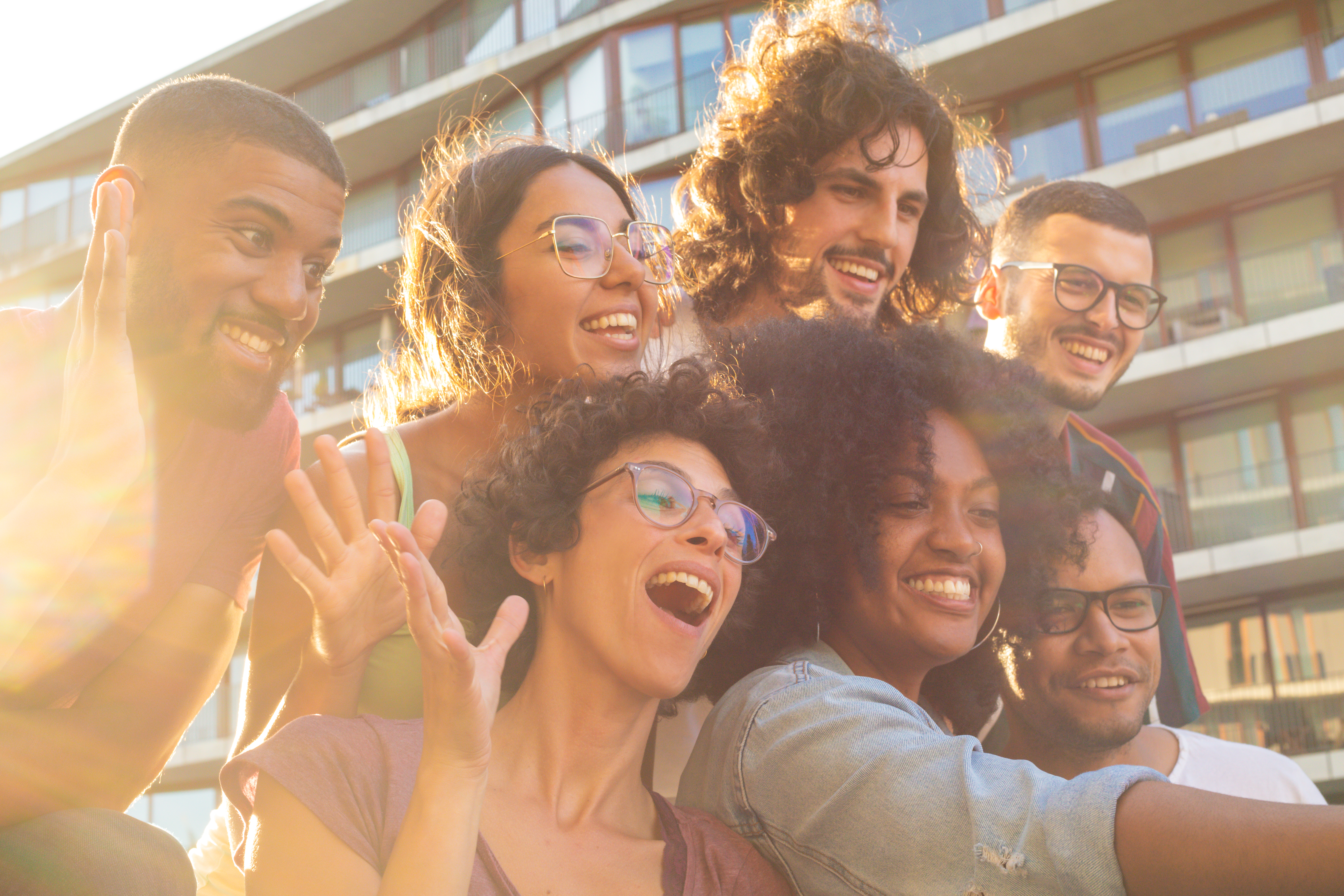 Multiethnic group of friends smiling for an outdoor selfie