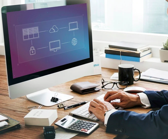 Professional using computer with integration diagram between servers, cloud and devices